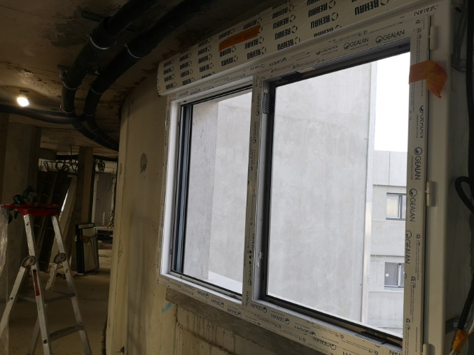 Baies coulissantes ALU bardage bois